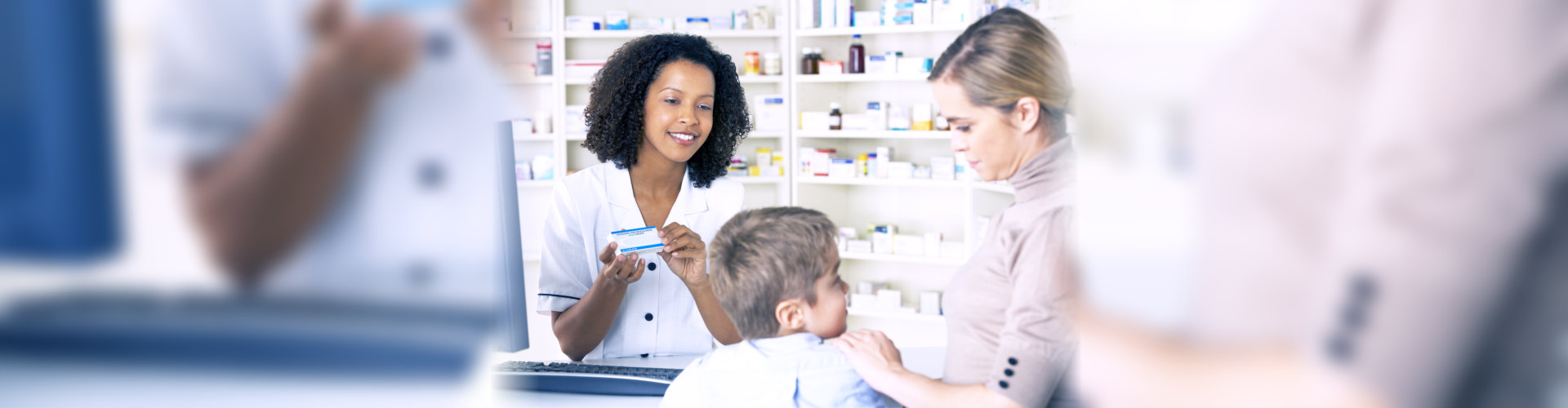 pharmacist entertaining customer with child
